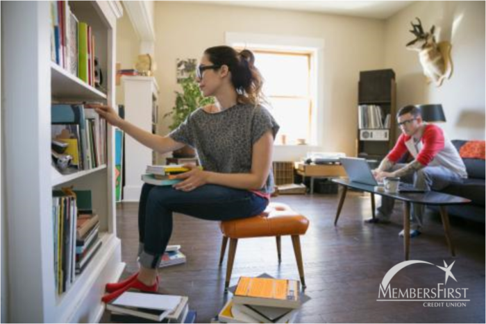 young woman cleaning off shelves looking for extra cash