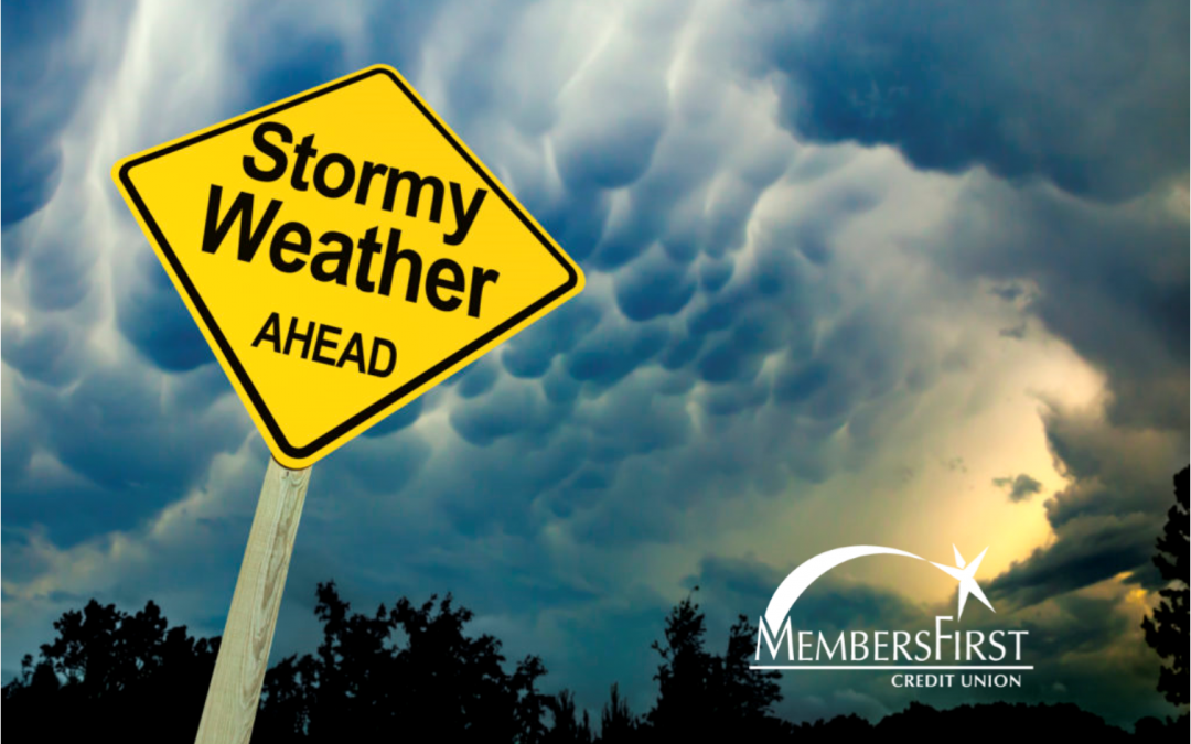 Road side displaying 'stormy weather ahead' in front of a stormy sky.